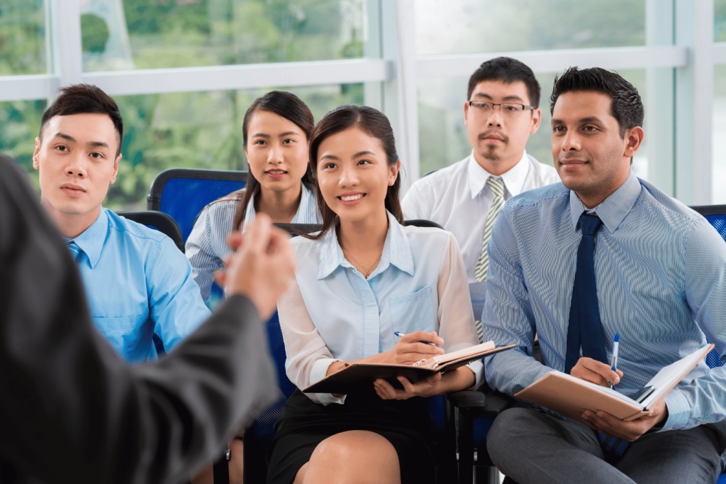 a group of people sitting in chairs